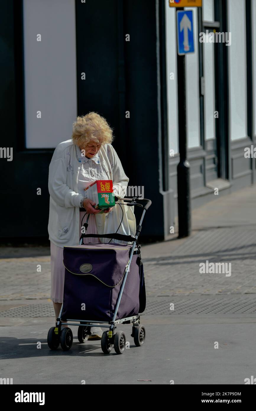 Old lady shopping trolley hi-res stock photography and images - Alamy