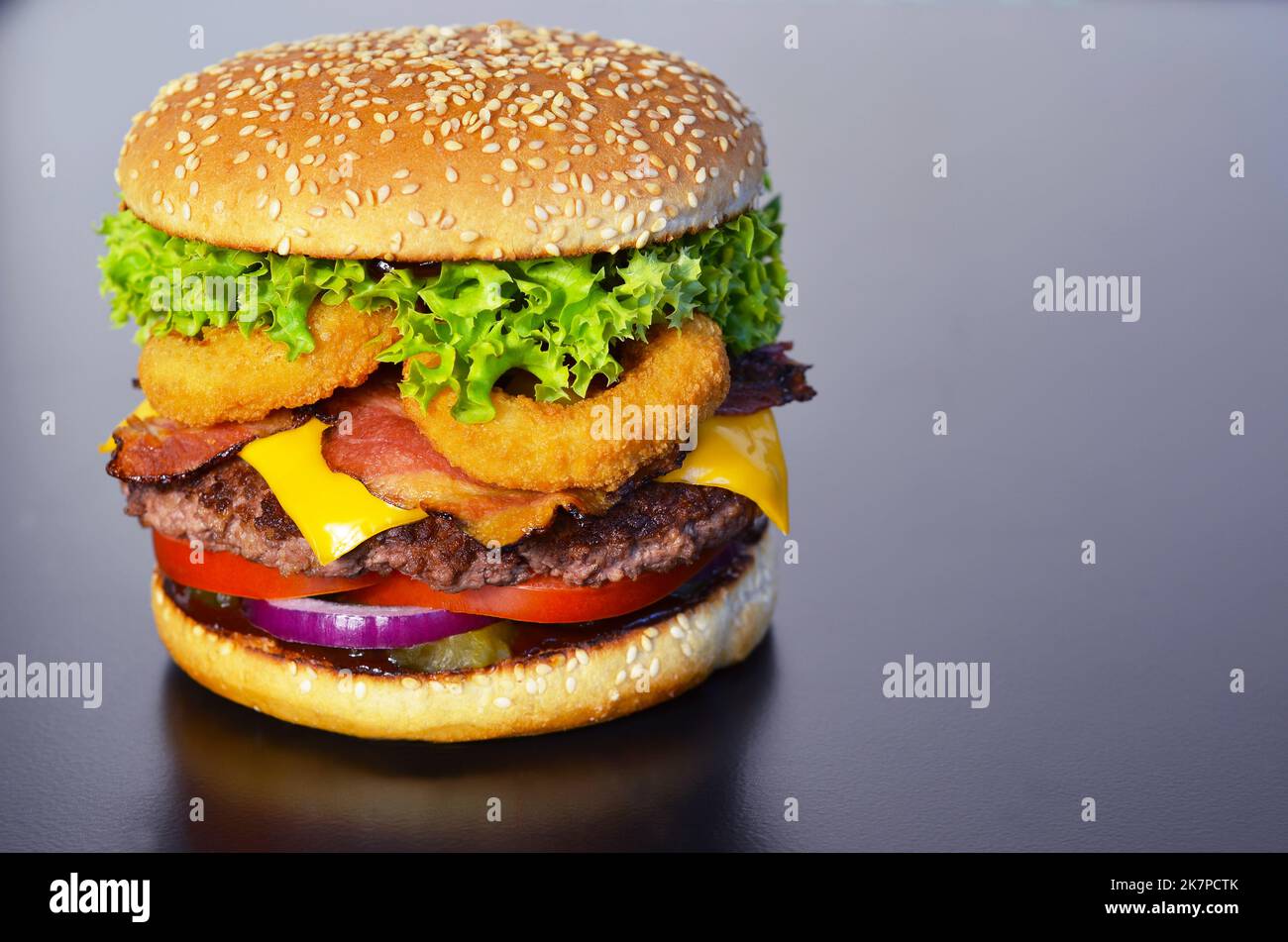 appetizing burger on a black background 91 Stock Photo