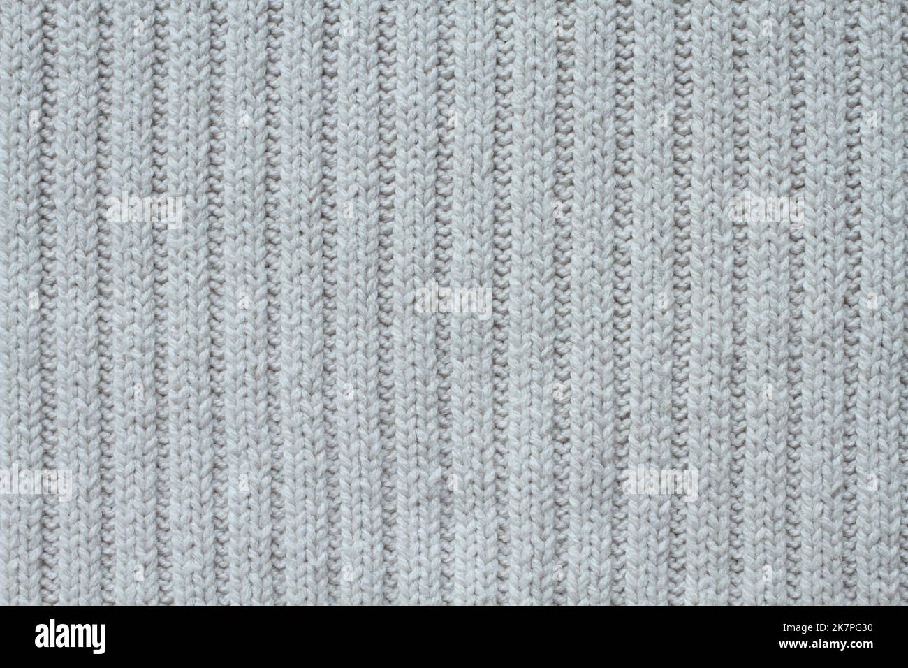Light beige cotton knitted fabric texture. Macro. Stock Photo