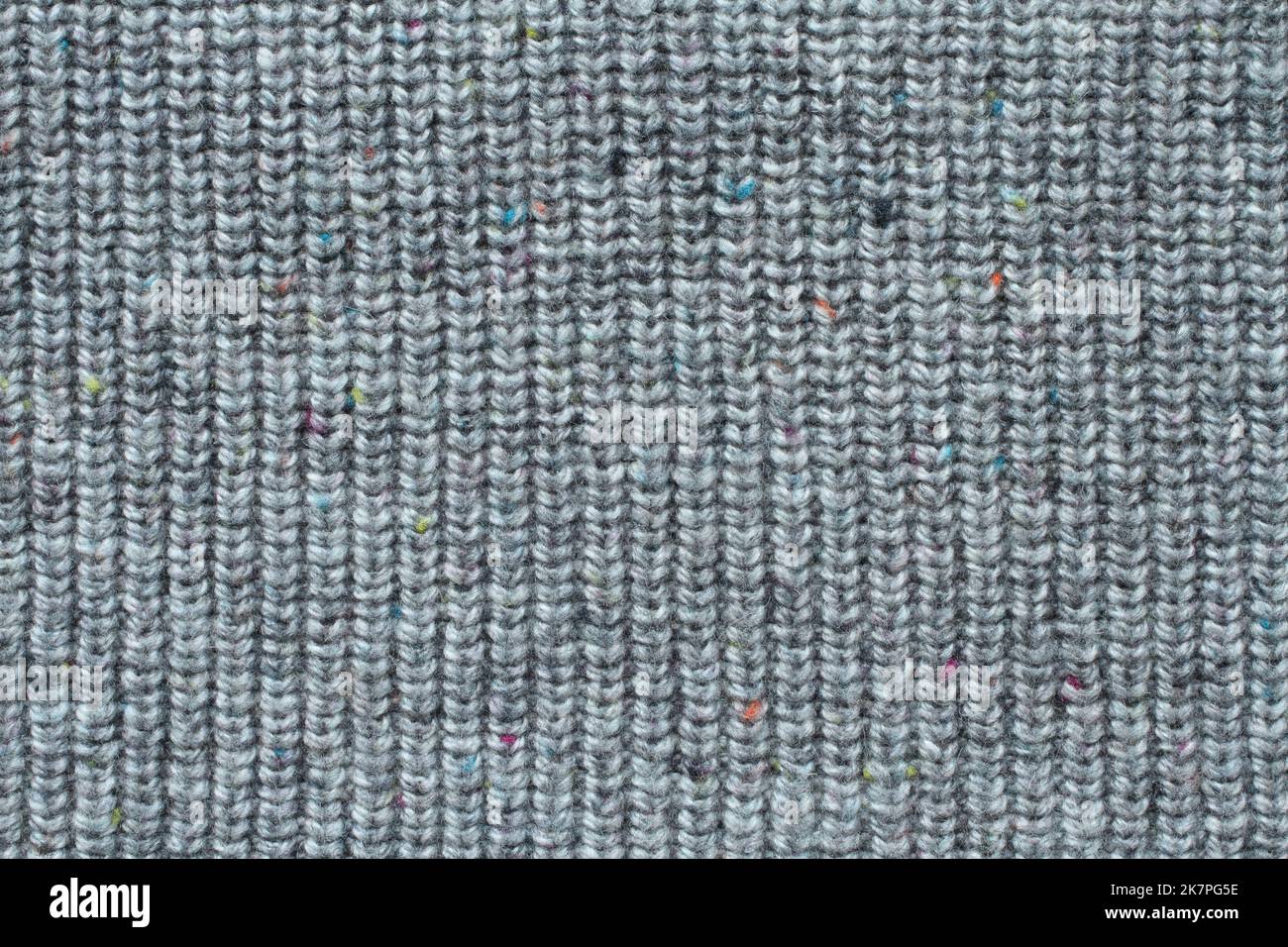 Light gray woolen knitted fabric texture. Macro. Stock Photo