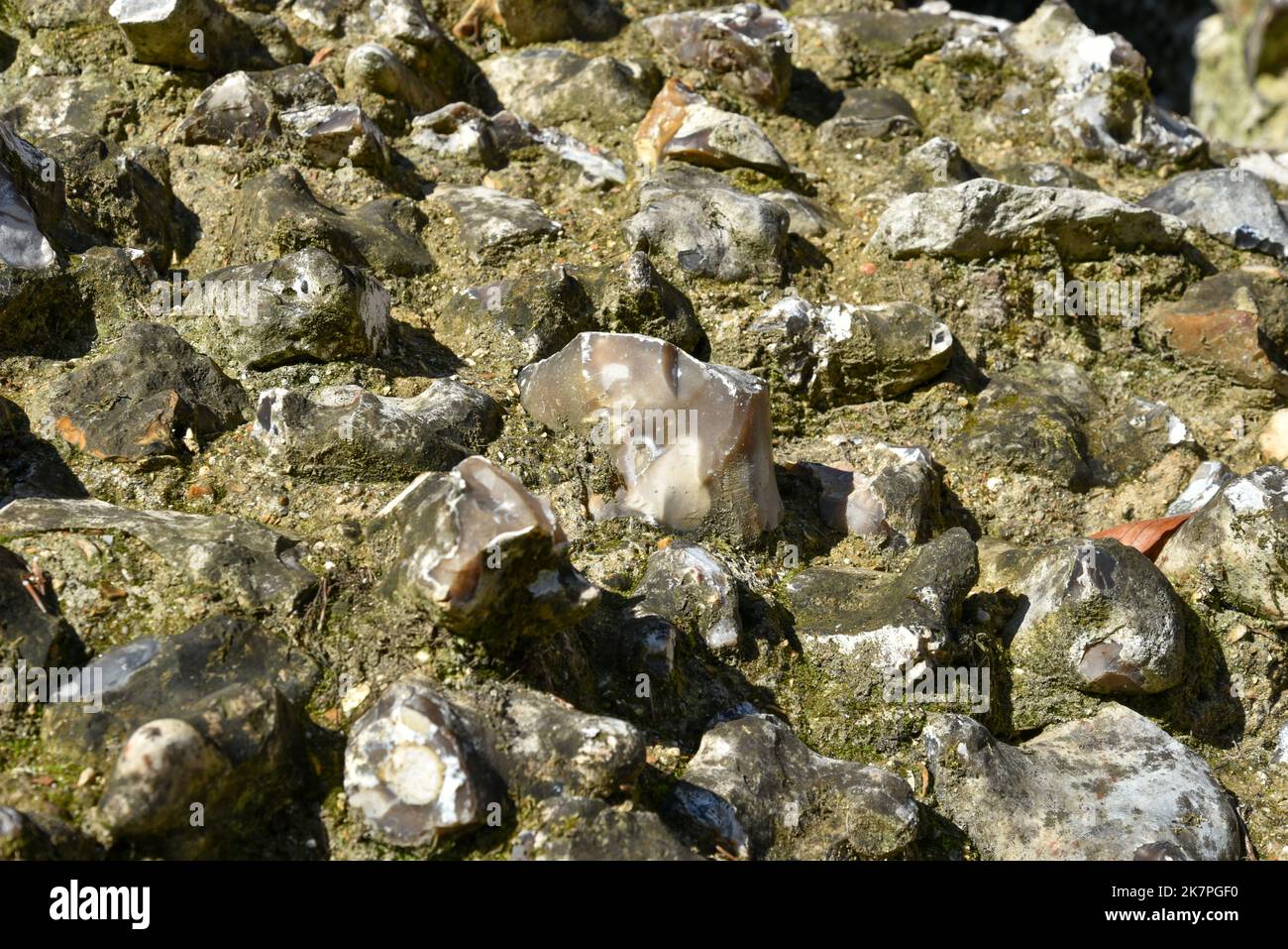 Close up of a wall constructed using flint inside an old English castle. Stock Photo