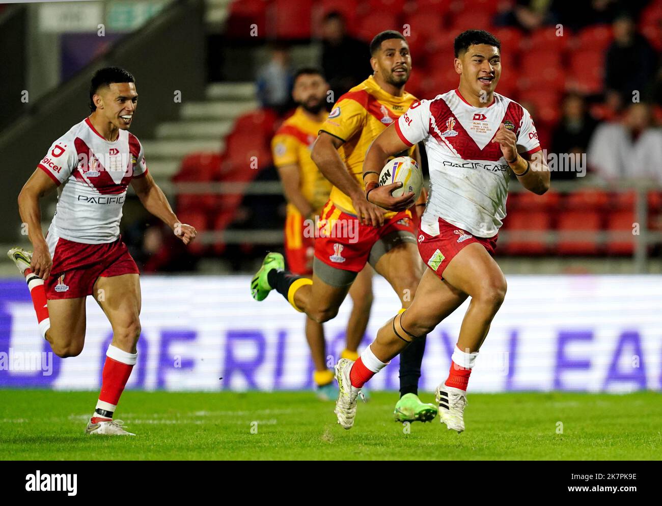 Tonga’s Isaiya Katoa breaks through on his way to score a try during the Rugby League World Cup group D match at Totally Wicked Stadium, St Helens. Picture date: Tuesday October 18, 2022. Stock Photo