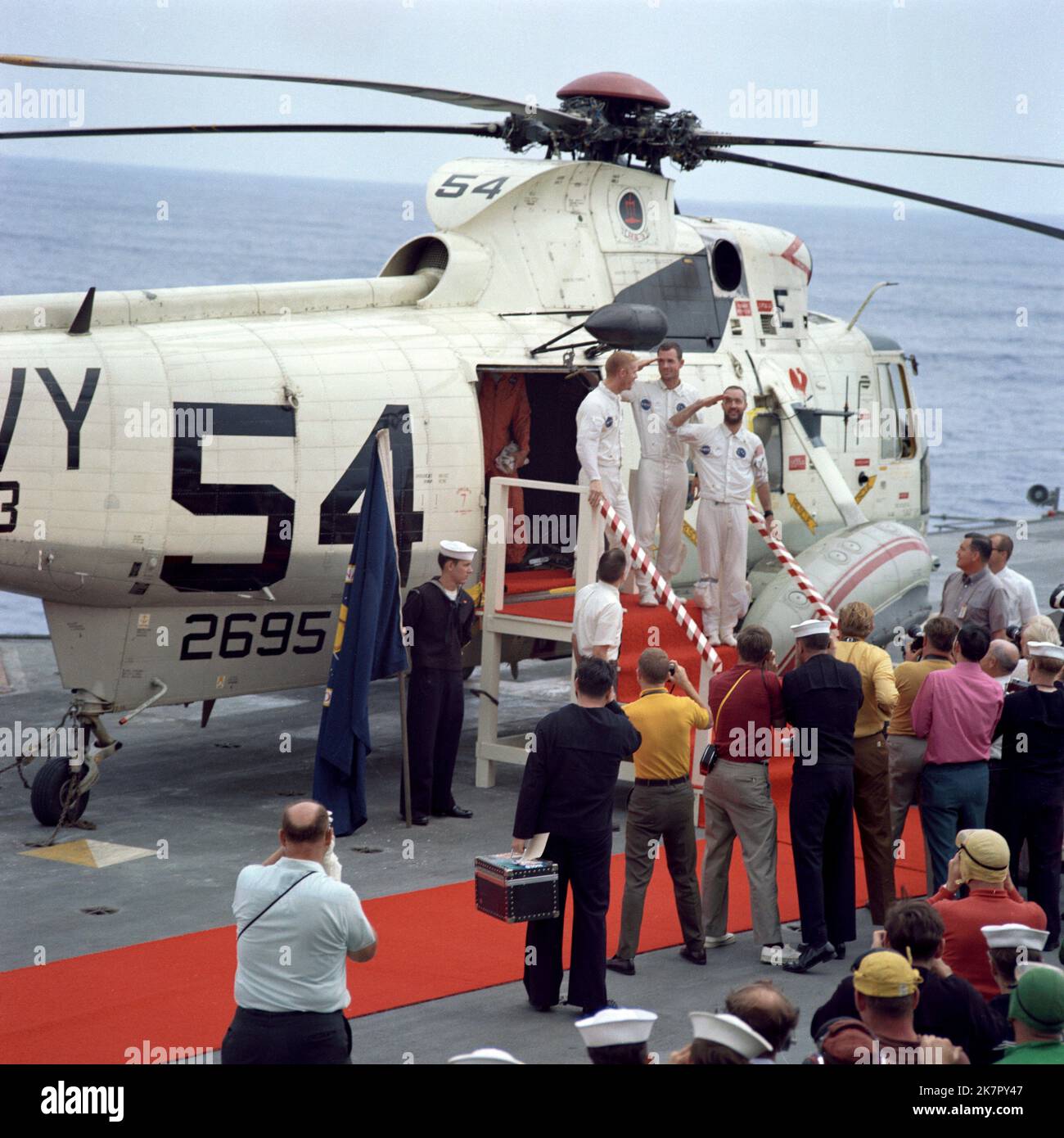USS Guadalcanal, United States. 18th Oct, 2022. NASA Apollo 9 astronauts, left to right, Russell Schweickart, David Scott, and James McDivitt salute as they arrive aboard the USS Guadalcanal following Splashdown in the Atlantic Ocean, March 13, 1969 off the coast of Florida. McDivitt commanded the first Gemini spacewalk mission and commanded Apollo 9 during the first crewed orbital flight of a the lunar module, died October 15, 2022 at age 93. Credit: NASA/NASA/Alamy Live News Stock Photo