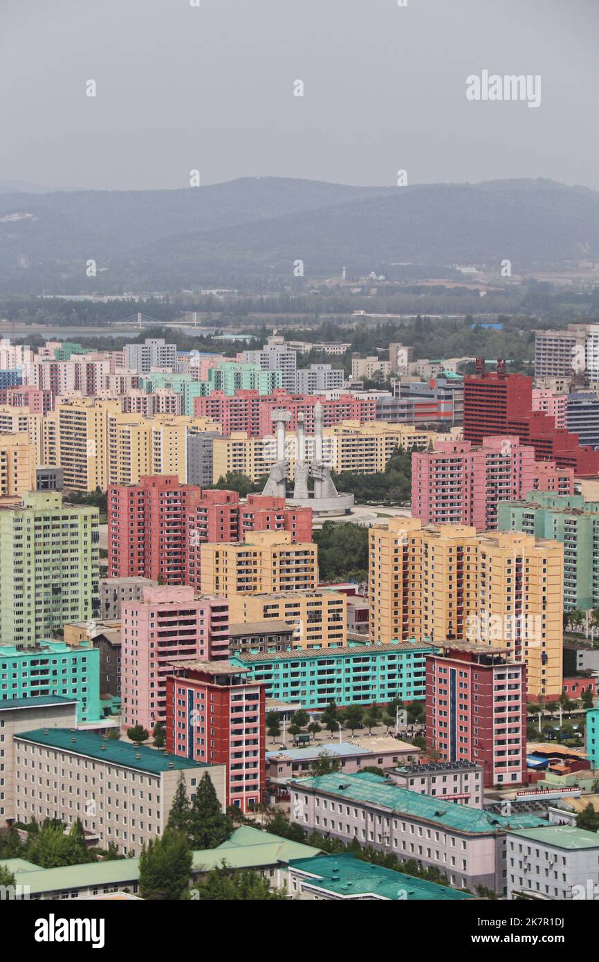 Pyongyang seen from the Juche Tower. A colorful set of buildings surround the Party Founder's Monument with its iconic sickle, hammer, and brush. Stock Photo