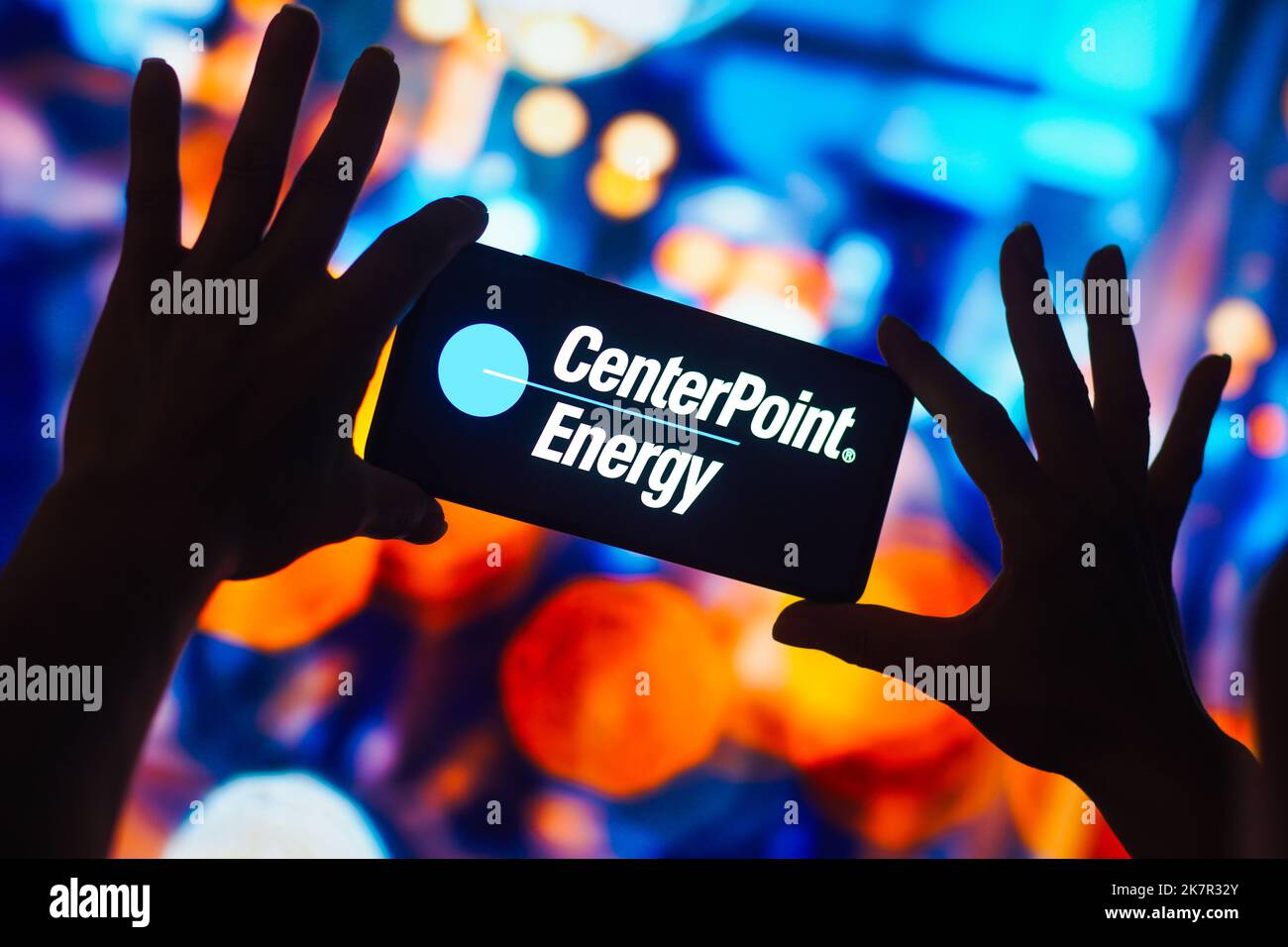 In this photo illustration, the CenterPoint Energy logo is displayed on