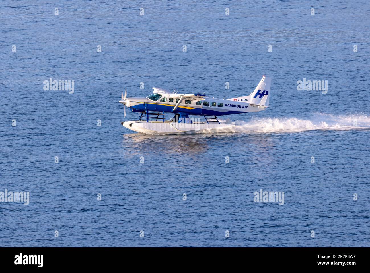 Harbour Air floatplane landing in Vancouver Harbour - Vancouver, British Columbia, Canada Stock Photo