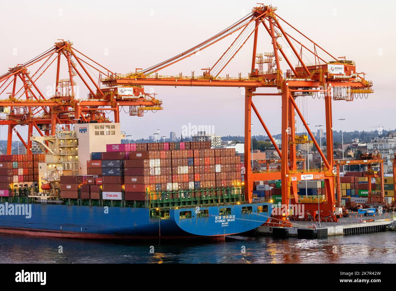 Cranes loading shipping containers in the Port of Vancouver - Vancouver, British Columbia, Canada Stock Photo