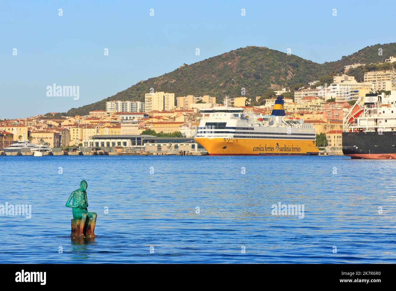 Gaia statue by Marc Petit and MS Mega Smeralda (1985) from Corsica Ferries - Sardinia Ferries in the port of Ajaccio (Corse-du-Sud) in Corsica, France Stock Photo