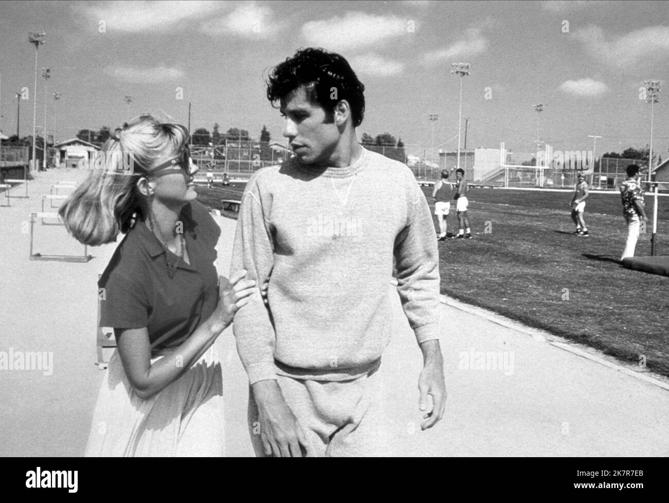 Olivia Newton-John,John Travolta Film: Grease (USA 1978) Characters: Sandy Olsson,Danny Zuko  Director: Randal Kleiser 13 June 1978   **WARNING** This Photograph is for editorial use only and is the copyright of PARAMOUNT PICTURES and/or the Photographer assigned by the Film or Production Company and can only be reproduced by publications in conjunction with the promotion of the above Film. A Mandatory Credit To PARAMOUNT PICTURES is required. The Photographer should also be credited when known. No commercial use can be granted without written authority from the Film Company. Stock Photo
