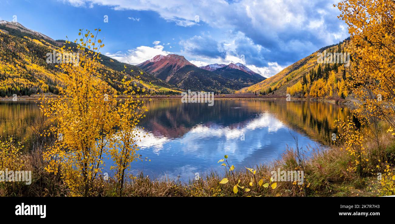 The Red Mountains reflected in Crystal Lake during peak color near Ouray, Colorado. Stock Photo
