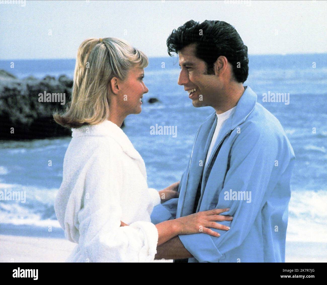 Olivia Newton-John & John Travolta Film: Grease (USA 1978) Characters: Sandy Olsson, Danny Zuko  Director: Randal Kleiser 13 June 1978   **WARNING** This Photograph is for editorial use only and is the copyright of PARAMOUNT PICTURES and/or the Photographer assigned by the Film or Production Company and can only be reproduced by publications in conjunction with the promotion of the above Film. A Mandatory Credit To PARAMOUNT PICTURES is required. The Photographer should also be credited when known. No commercial use can be granted without written authority from the Film Company. Stock Photo
