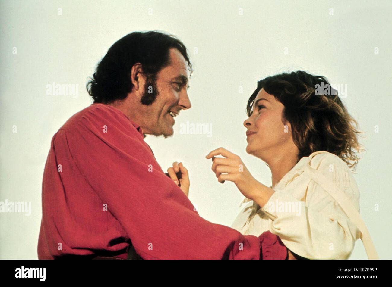 Robert Shaw & Genevieve Bujold Film: Scarlet Buccaneer; Swashbuckler (1976) Characters: Ned Lynch &  Director: James Goldstone 29 July 1976   **WARNING** This Photograph is for editorial use only and is the copyright of UNIVERSAL and/or the Photographer assigned by the Film or Production Company and can only be reproduced by publications in conjunction with the promotion of the above Film. A Mandatory Credit To UNIVERSAL is required. The Photographer should also be credited when known. No commercial use can be granted without written authority from the Film Company. Stock Photo