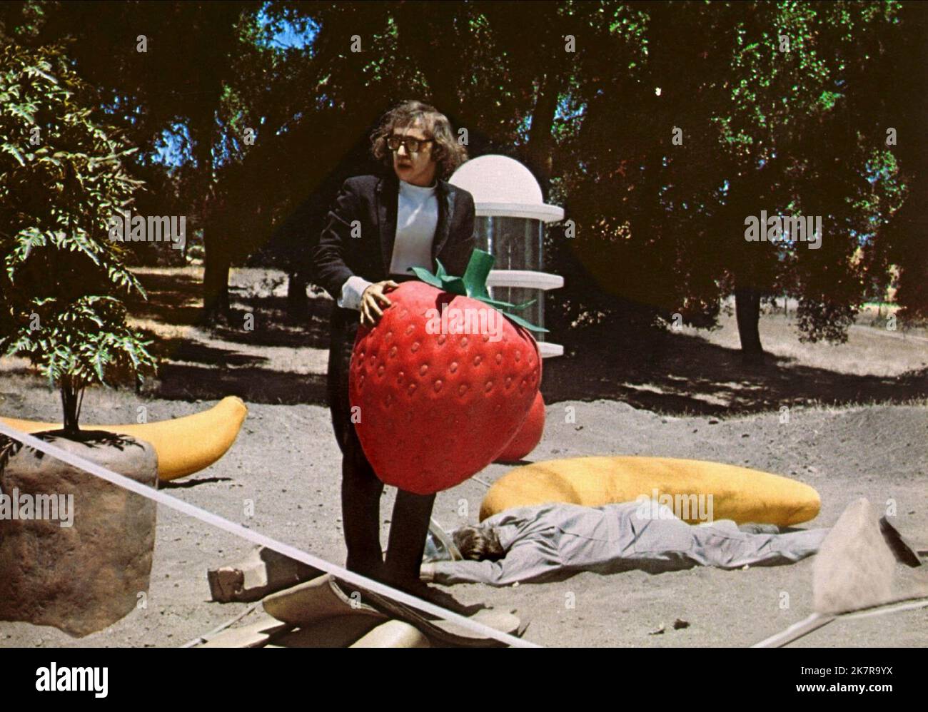 Woody Allen & Large Fruit Film: Sleeper (USA 1973) Characters: Miles Monroe &  Director: Woody Allen 17 December 1973   **WARNING** This Photograph is for editorial use only and is the copyright of UNITED ARTISTS and/or the Photographer assigned by the Film or Production Company and can only be reproduced by publications in conjunction with the promotion of the above Film. A Mandatory Credit To UNITED ARTISTS is required. The Photographer should also be credited when known. No commercial use can be granted without written authority from the Film Company. Stock Photo