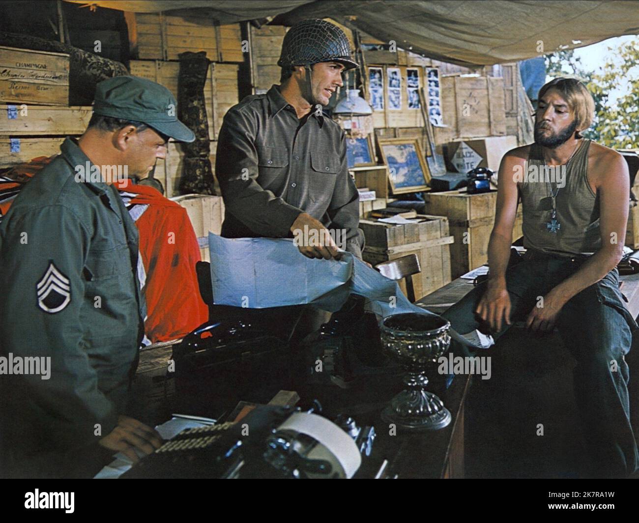 Clint Eastwood & Donald Sutherland Film: Kelly'S Heroes (USA/YU 1970) Characters: Pvt. Kelly & Sgt. Oddball (tank commander)  Director: Brian G.Hutton 23 June 1970   **WARNING** This Photograph is for editorial use only and is the copyright of MGM and/or the Photographer assigned by the Film or Production Company and can only be reproduced by publications in conjunction with the promotion of the above Film. A Mandatory Credit To MGM is required. The Photographer should also be credited when known. No commercial use can be granted without written authority from the Film Company. Stock Photo
