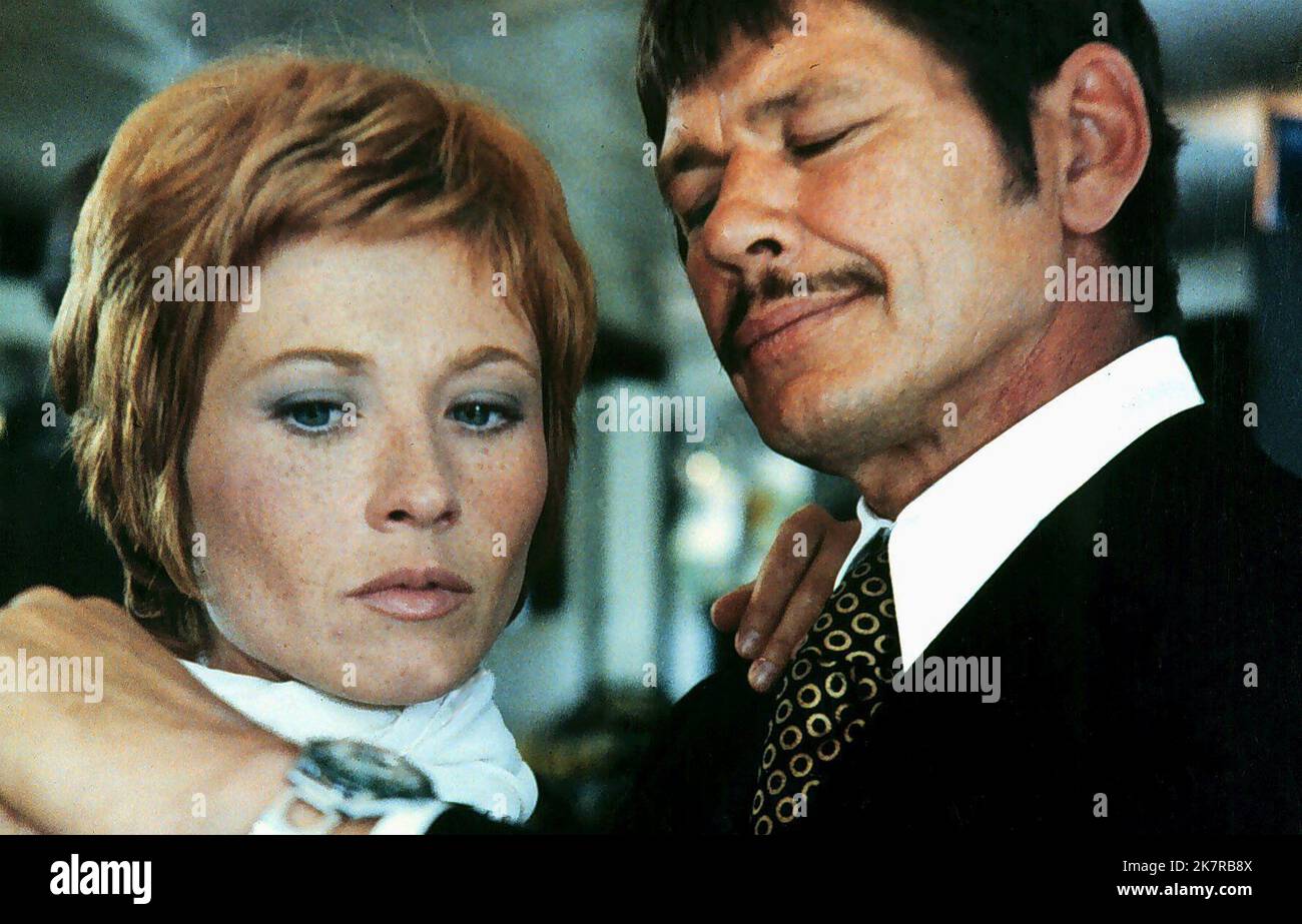 Marlene Jobert & Charles Bronson Film: Rider On The Rain (1976) Characters: & Col. Harry Dobbs  Director: Rene Clement 24 May 1970   **WARNING** This Photograph is for editorial use only and is the copyright of The Film Company and/or the Photographer assigned by the Film or Production Company and can only be reproduced by publications in conjunction with the promotion of the above Film. A Mandatory Credit To The Film Company is required. The Photographer should also be credited when known. No commercial use can be granted without written authority from the Film Company. Stock Photo