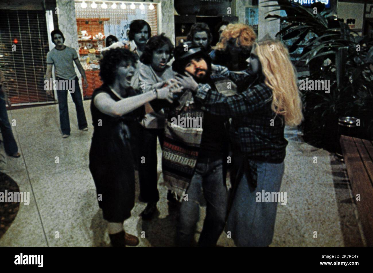 Zombies Scene Film: Dawn Of The Dead (USA/IT 1978)   Director: George A. Romero 01 September 1978   **WARNING** This Photograph is for editorial use only and is the copyright of DAWN ASSOCIATES and/or the Photographer assigned by the Film or Production Company and can only be reproduced by publications in conjunction with the promotion of the above Film. A Mandatory Credit To DAWN ASSOCIATES is required. The Photographer should also be credited when known. No commercial use can be granted without written authority from the Film Company. Stock Photo