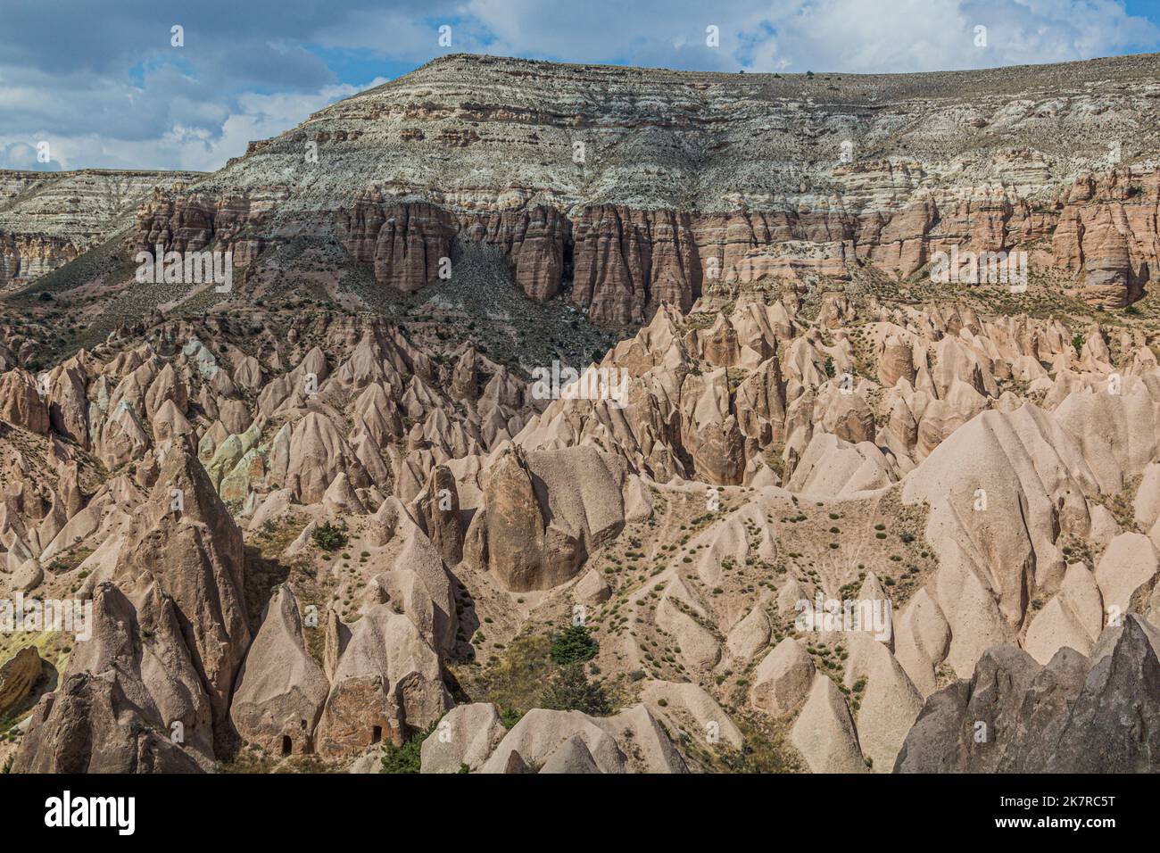 View of rock formations Fairy Chimneys of the Rose valley in Cappadocia ...