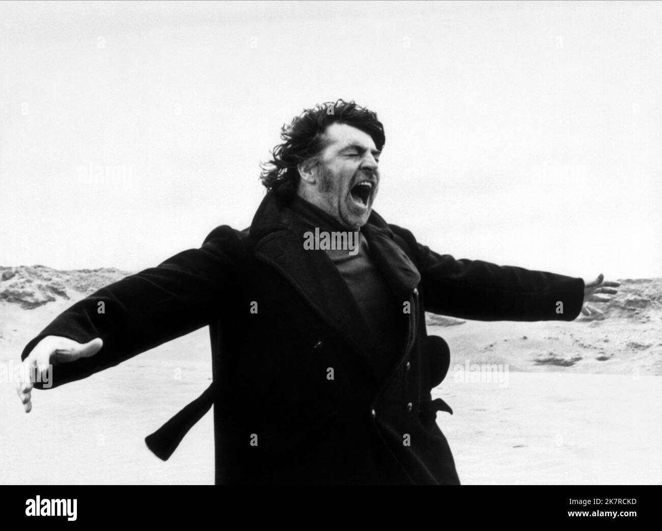 Alan Bates Film: The Shout (1973) Characters: Crossley  Director: Jerzy Skolimowski 19 May 1978   **WARNING** This Photograph is for editorial use only and is the copyright of THE RANK and/or the Photographer assigned by the Film or Production Company and can only be reproduced by publications in conjunction with the promotion of the above Film. A Mandatory Credit To THE RANK is required. The Photographer should also be credited when known. No commercial use can be granted without written authority from the Film Company. Stock Photo