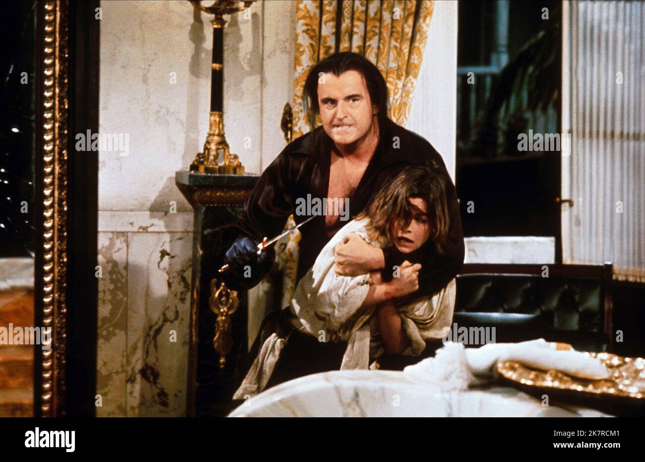 Peter Boyle & Genevieve Bujold Film: Scarlet Buccaneer; Swashbuckler (1976) Characters: Lord Durant, Jane Barnet  Director: James Goldstone 29 July 1976   **WARNING** This Photograph is for editorial use only and is the copyright of UNIVERSAL and/or the Photographer assigned by the Film or Production Company and can only be reproduced by publications in conjunction with the promotion of the above Film. A Mandatory Credit To UNIVERSAL is required. The Photographer should also be credited when known. No commercial use can be granted without written authority from the Film Company. Stock Photo