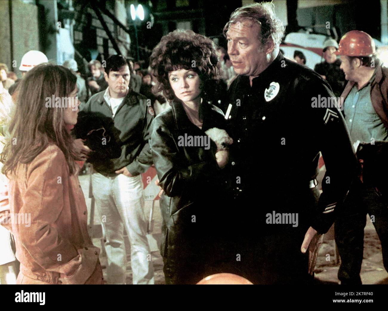 Victoria Principal, Genevieve Bujold & George Kennedy Film: Earthquake (1974) Characters: Rosa Amici, & Sgt. Lew Slade  Director: Mark Robson 15 November 1974   **WARNING** This Photograph is for editorial use only and is the copyright of UNIVERSAL and/or the Photographer assigned by the Film or Production Company and can only be reproduced by publications in conjunction with the promotion of the above Film. A Mandatory Credit To UNIVERSAL is required. The Photographer should also be credited when known. No commercial use can be granted without written authority from the Film Company. Stock Photo