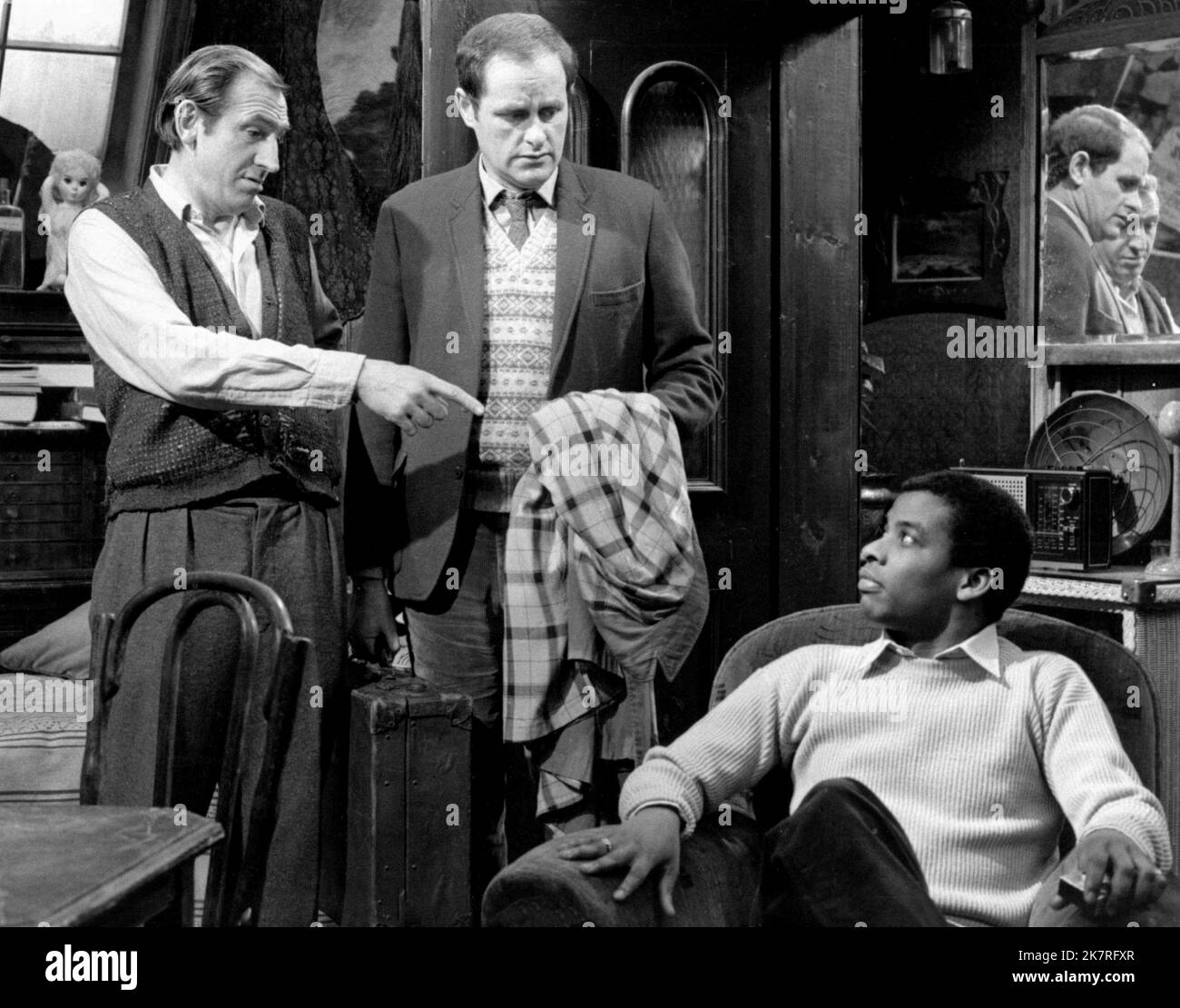 Leonard Rossiter, John Clive & Don Warrington Television: Rising Damp (1974) Characters: Rupert Rigsby,Gwyn / ... (2 episodes, 1977-1978) & Philip Smith  Director: Ronnie Baxter, Veron Lawrence 02 September 1974   **WARNING** This Photograph is for editorial use only and is the copyright of YORKSHIRE TELEVISION and/or the Photographer assigned by the Film or Production Company and can only be reproduced by publications in conjunction with the promotion of the above Film. A Mandatory Credit To YORKSHIRE TELEVISION is required. The Photographer should also be credited when known. No commercial u Stock Photo