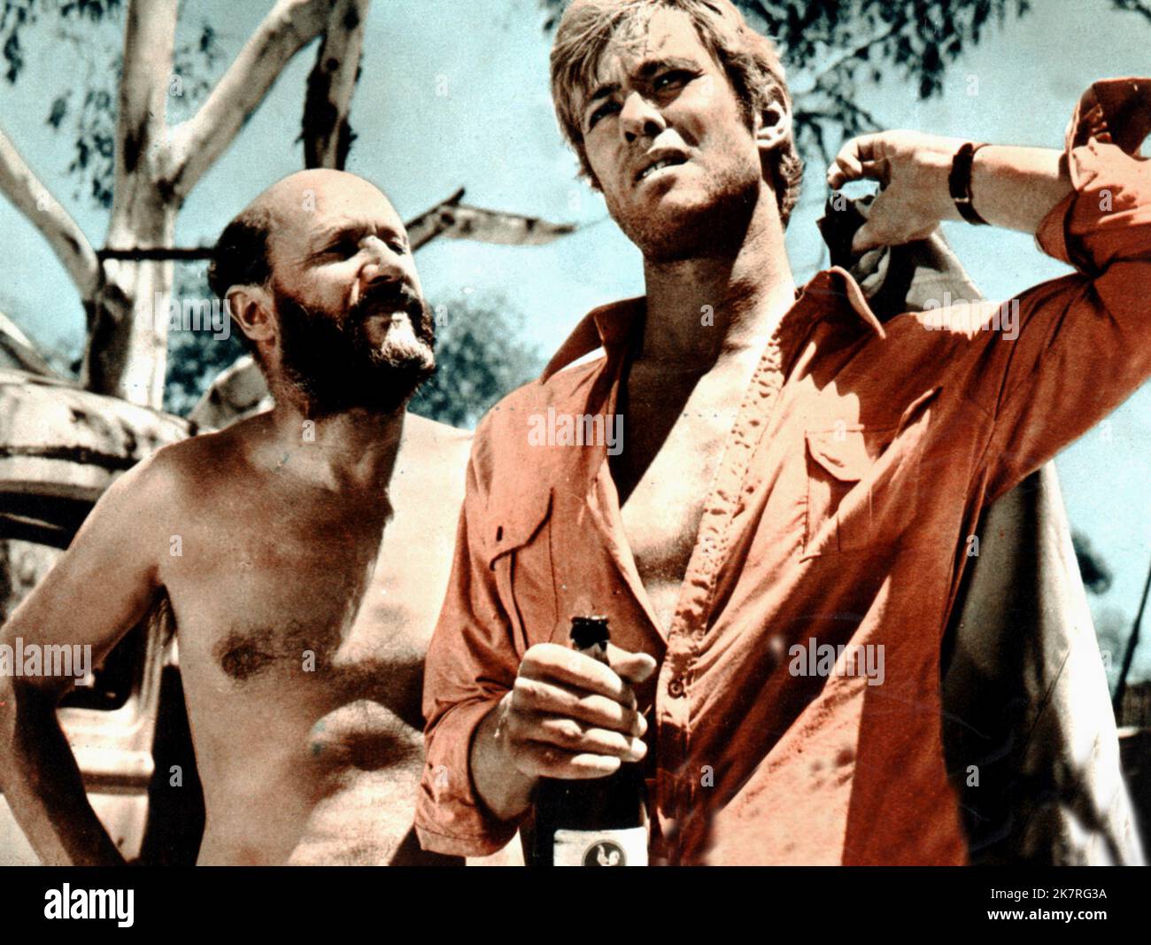 Donald Pleasence & Gary Bond Film: Wake In Fright; Outback (USA/UK/AUS 1971)   Director: Ted Kotcheff 18 May 1971   **WARNING** This Photograph is for editorial use only and is the copyright of UNITED ARTISTS and/or the Photographer assigned by the Film or Production Company and can only be reproduced by publications in conjunction with the promotion of the above Film. A Mandatory Credit To UNITED ARTISTS is required. The Photographer should also be credited when known. No commercial use can be granted without written authority from the Film Company. Stock Photo