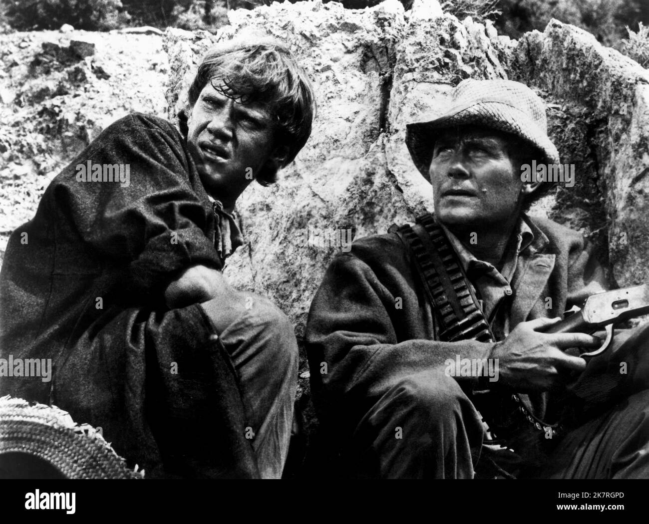 Malcolm Mcdowell & Robert Shaw Film: Figures In A Landscape (UK 1970) Characters: Ansell & MacConnachie  Director: Joseph Losey 11 November 1970   **WARNING** This Photograph is for editorial use only and is the copyright of CINECREST and/or the Photographer assigned by the Film or Production Company and can only be reproduced by publications in conjunction with the promotion of the above Film. A Mandatory Credit To CINECREST is required. The Photographer should also be credited when known. No commercial use can be granted without written authority from the Film Company. Stock Photo