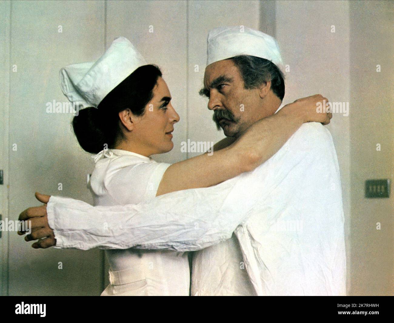 Eleanor Bron & Donald Sinden Film: The National Health (1970) Characters: Sister McFee / Sister Mary MacArthur & Mr. Carr / Senior Surgeon Boyd  Director: Jack Gold 01 June 1973   **WARNING** This Photograph is for editorial use only and is the copyright of COLUMBIA and/or the Photographer assigned by the Film or Production Company and can only be reproduced by publications in conjunction with the promotion of the above Film. A Mandatory Credit To COLUMBIA is required. The Photographer should also be credited when known. No commercial use can be granted without written authority from the Film Stock Photo