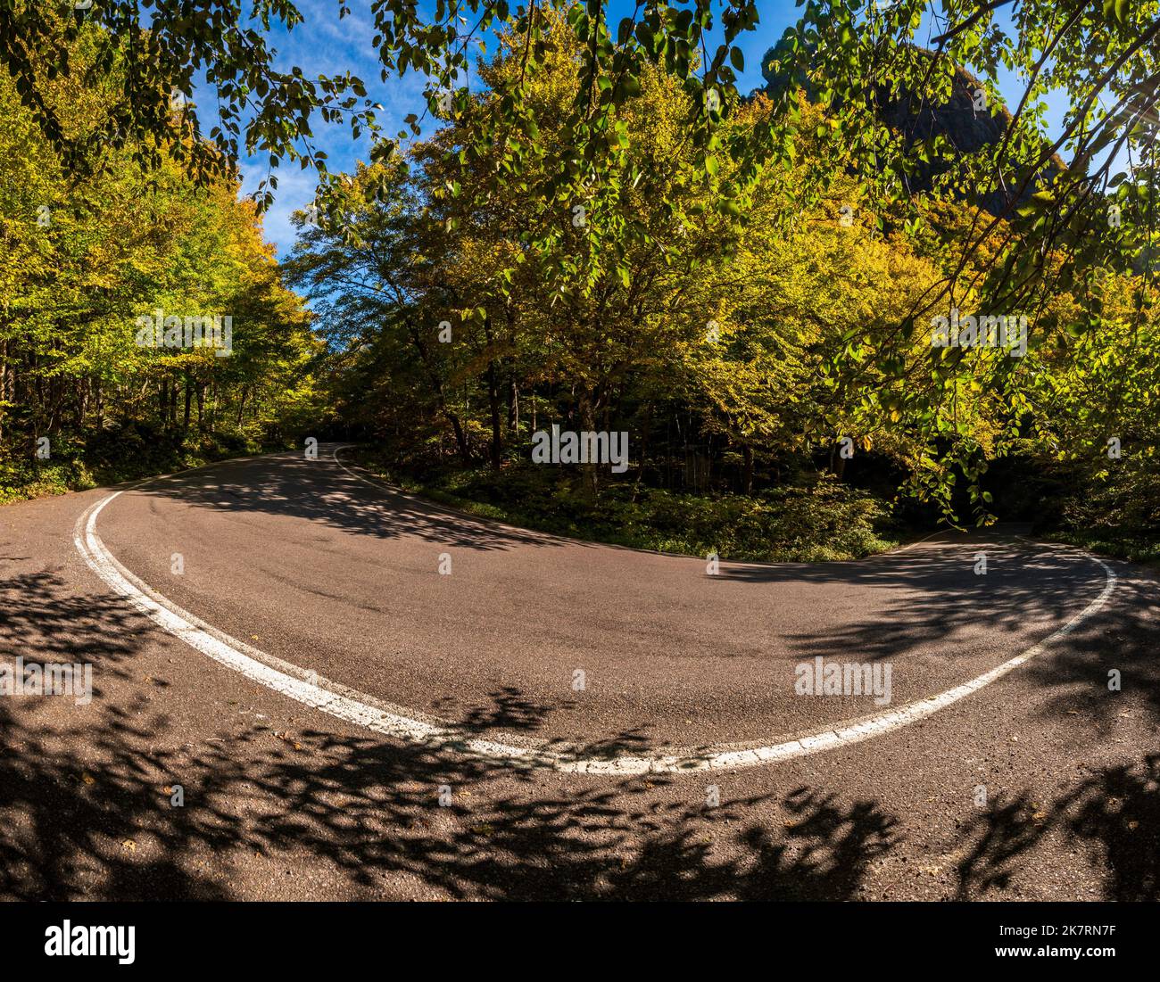 Narrow hairpin bend in the road through Smugglers Notch in the fall Stock Photo