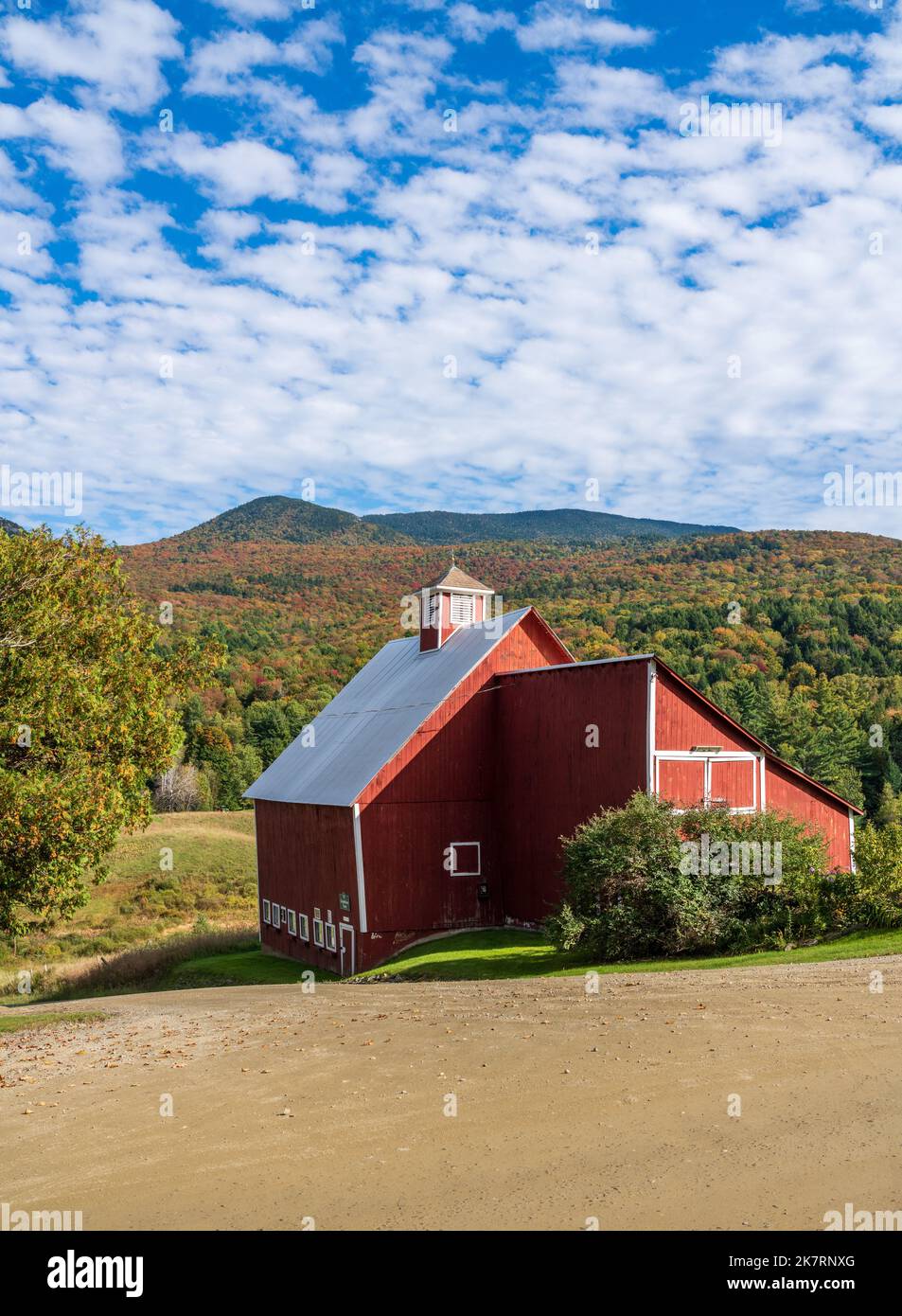 Grandview farm barn by the side of the track near Stowe in Vermont during the autumn color season Stock Photo