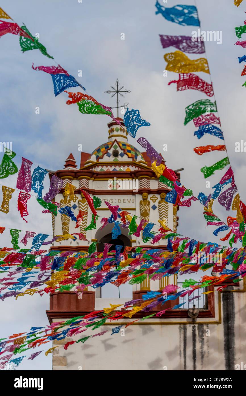 Decorated for a fiesta with Papel picados the Preciosa Sangre de Cristo Church in Teotitlan del Valle, a small town in the Valles Centrales Region nea Stock Photo
