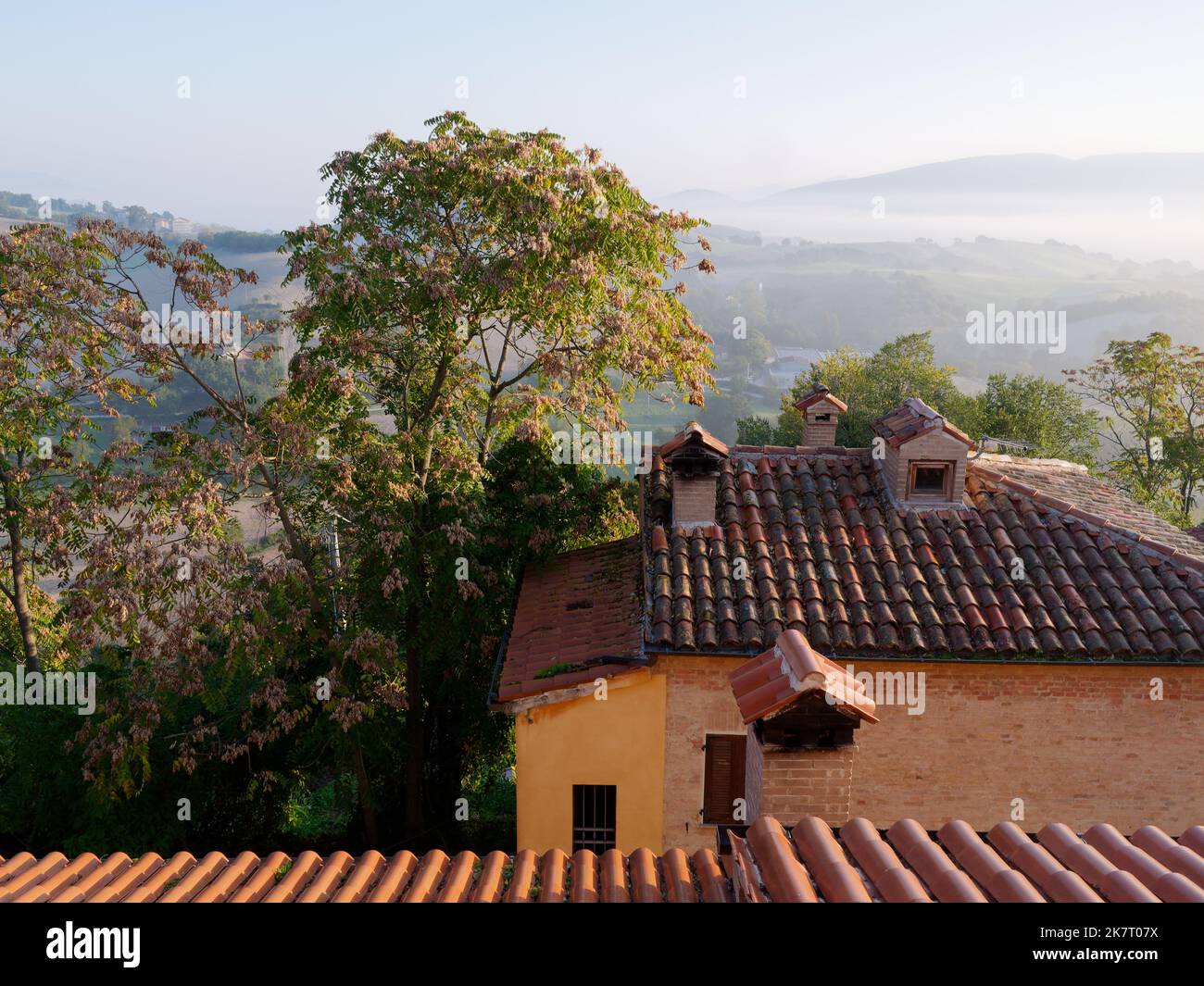 Misty morning view from a house in Coccore in the Le Marche region of Italy over the surrounding rolling hills and countryside. Stock Photo
