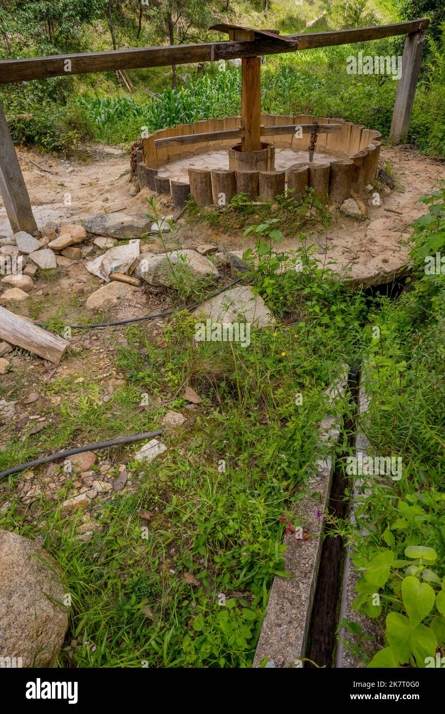 Old water powered wheel used to crush rocks to extract the gold near