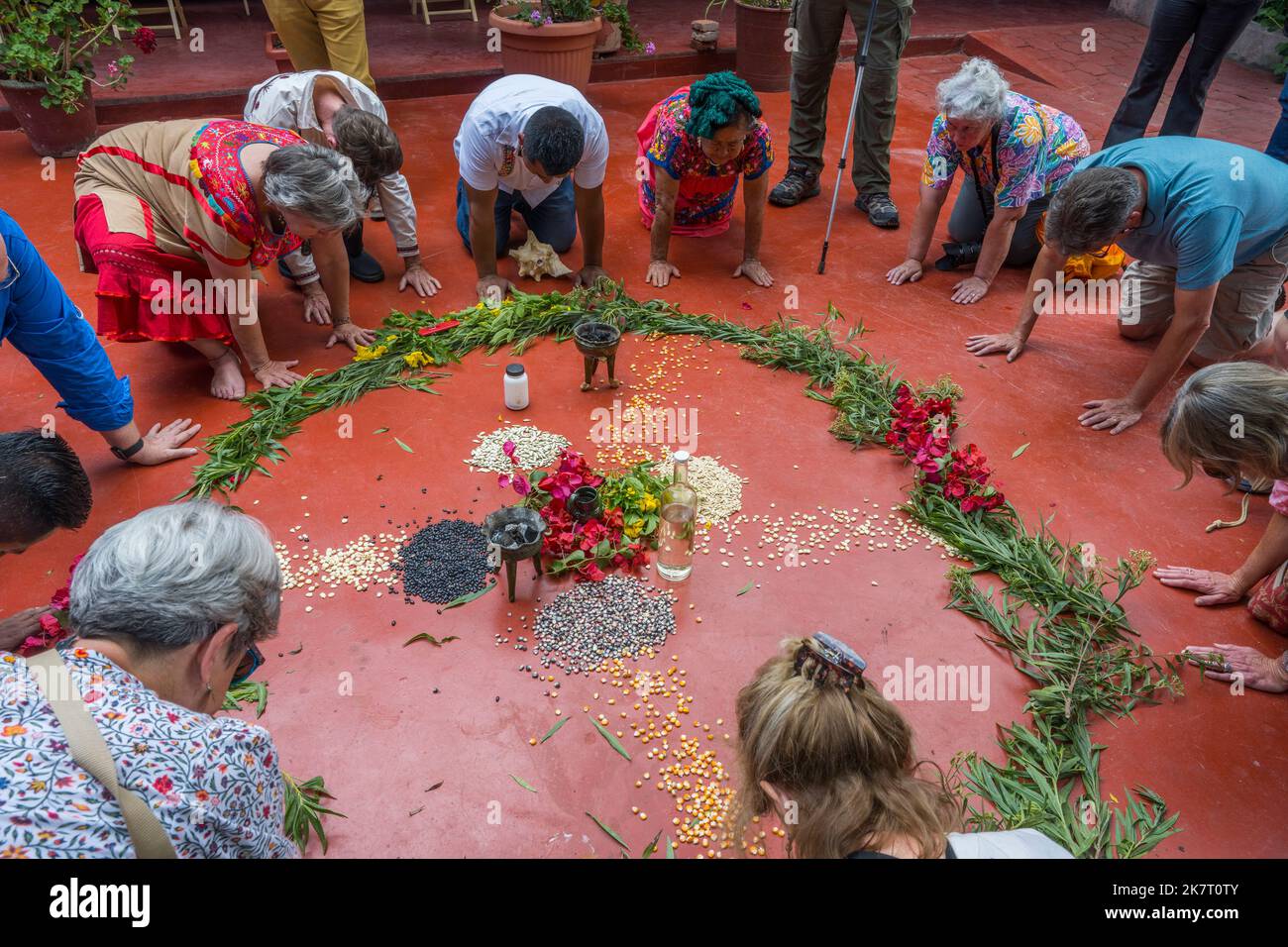 Aztec Ritual Washing Tourists participating in a Zapotec cleansing ceremony in the courtyard ...