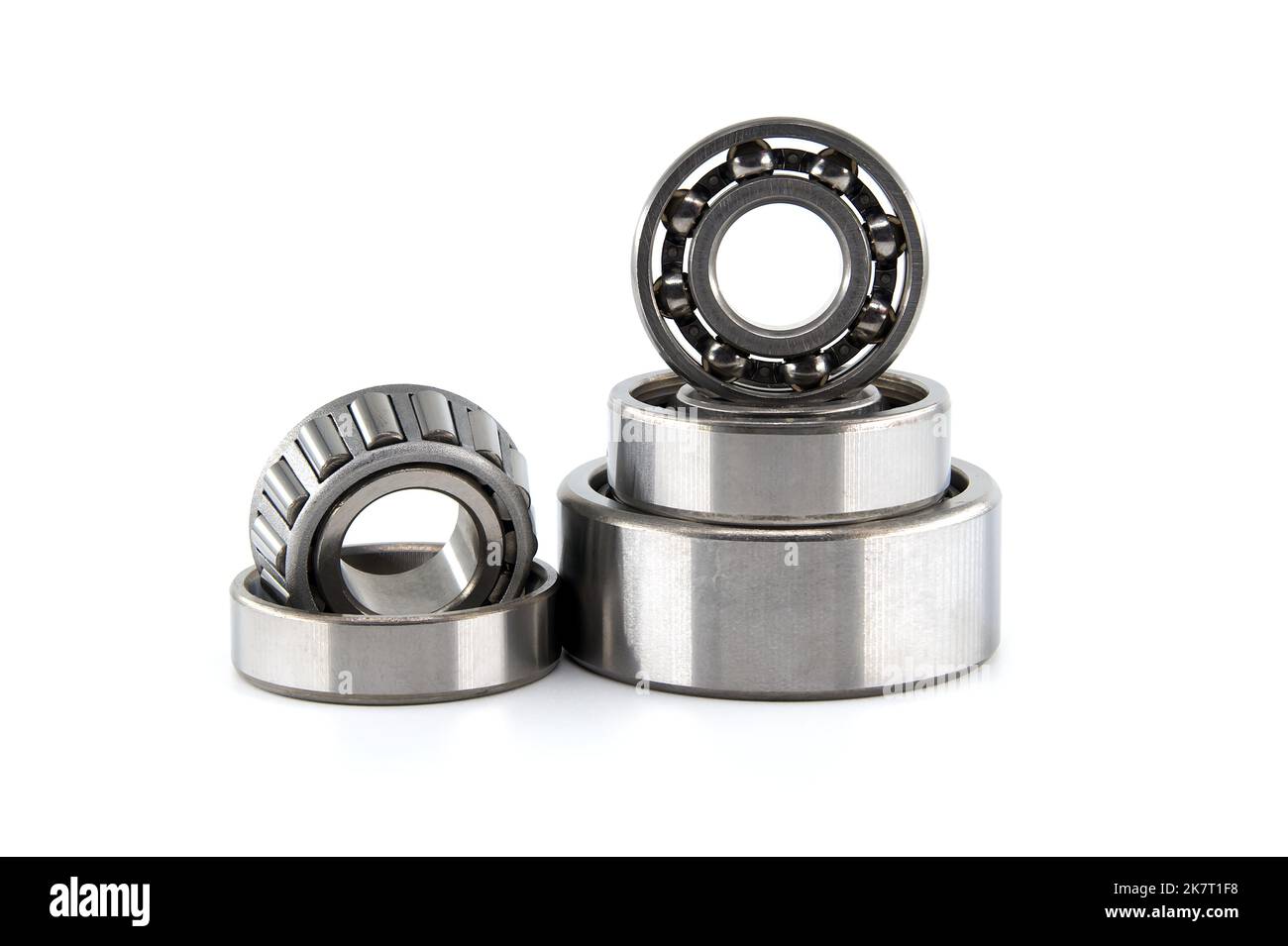 Group of various ball and roller bearings on white background. Spare ...