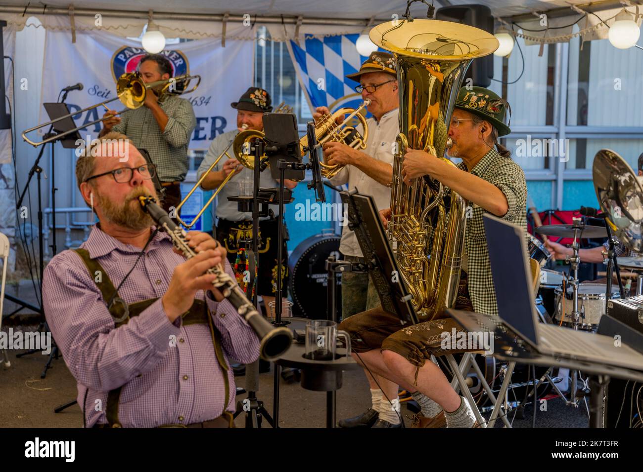 People enjoying the Oktoberfest celebrations with live music at the