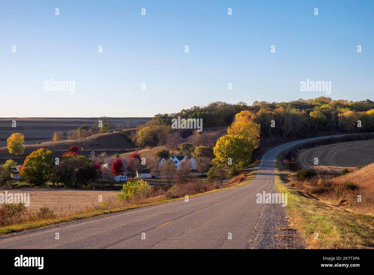 Rural road in the Loess Hills of western Iowa, evening in October Stock
