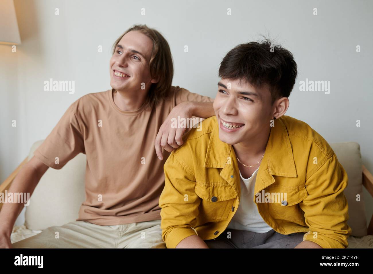 Joyful best friends spending time in college dormitory Stock Photo