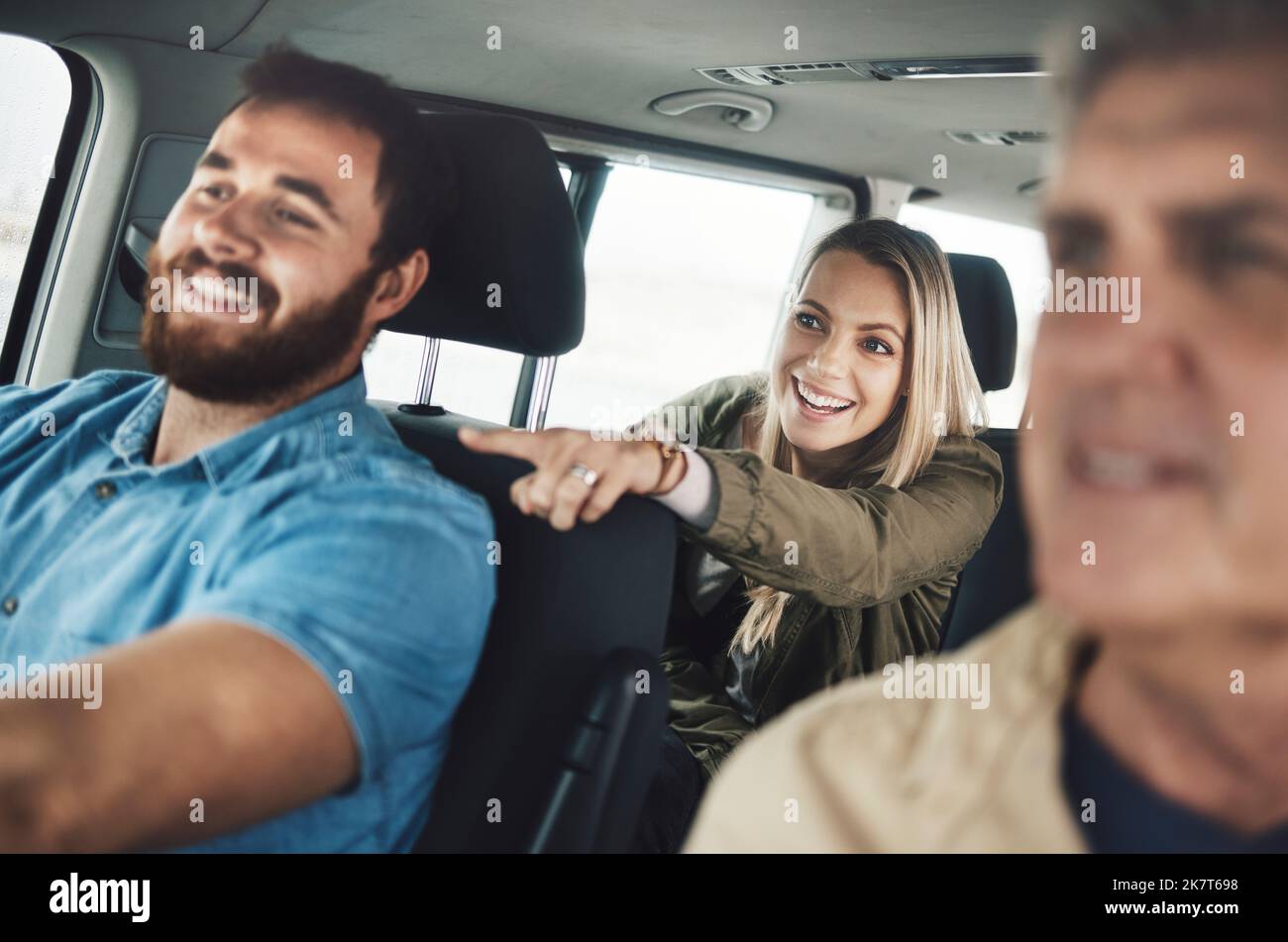 Car road trip, travel and happy family pointing to destination of holiday adventure, transportation journey or driving vacation site. Love, auto SUV Stock Photo