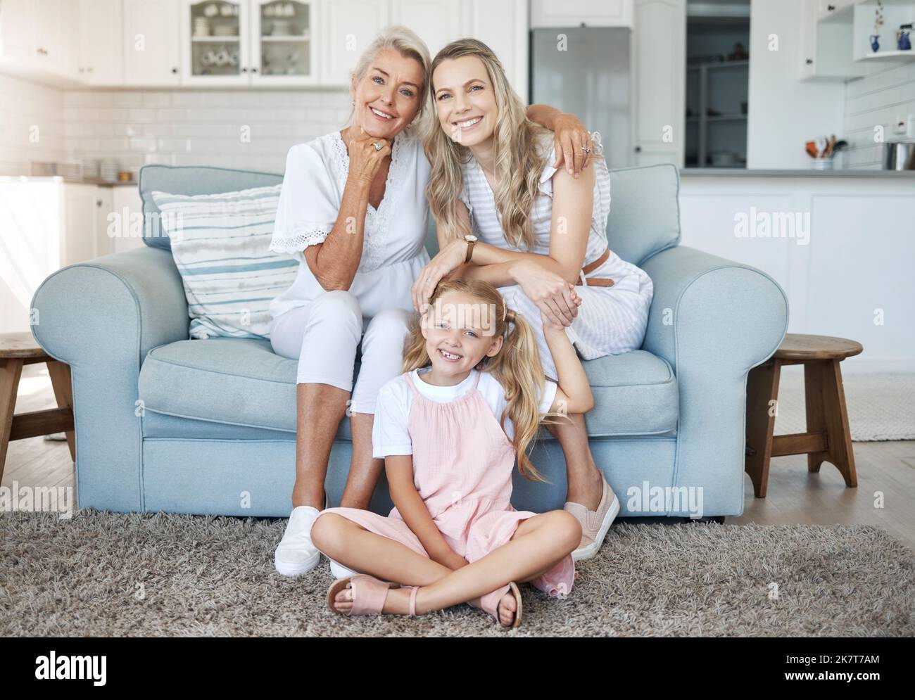 Mom, child and grandmother portrait on sofa for female generations in happy family relaxing. Love, care and bond of women relatives with smile at Stock Photo