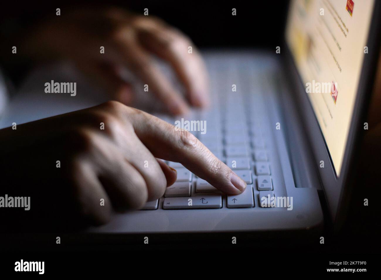 File photo dated 06/08/13 of a woman using a laptop. UK businesses must start taking cyber crime more seriously and do more including working more closely with the Government to protect themselves, the Chancellor of the Duchy of Lancaster has said. Issue date: Wednesday October 19, 2022. Stock Photo