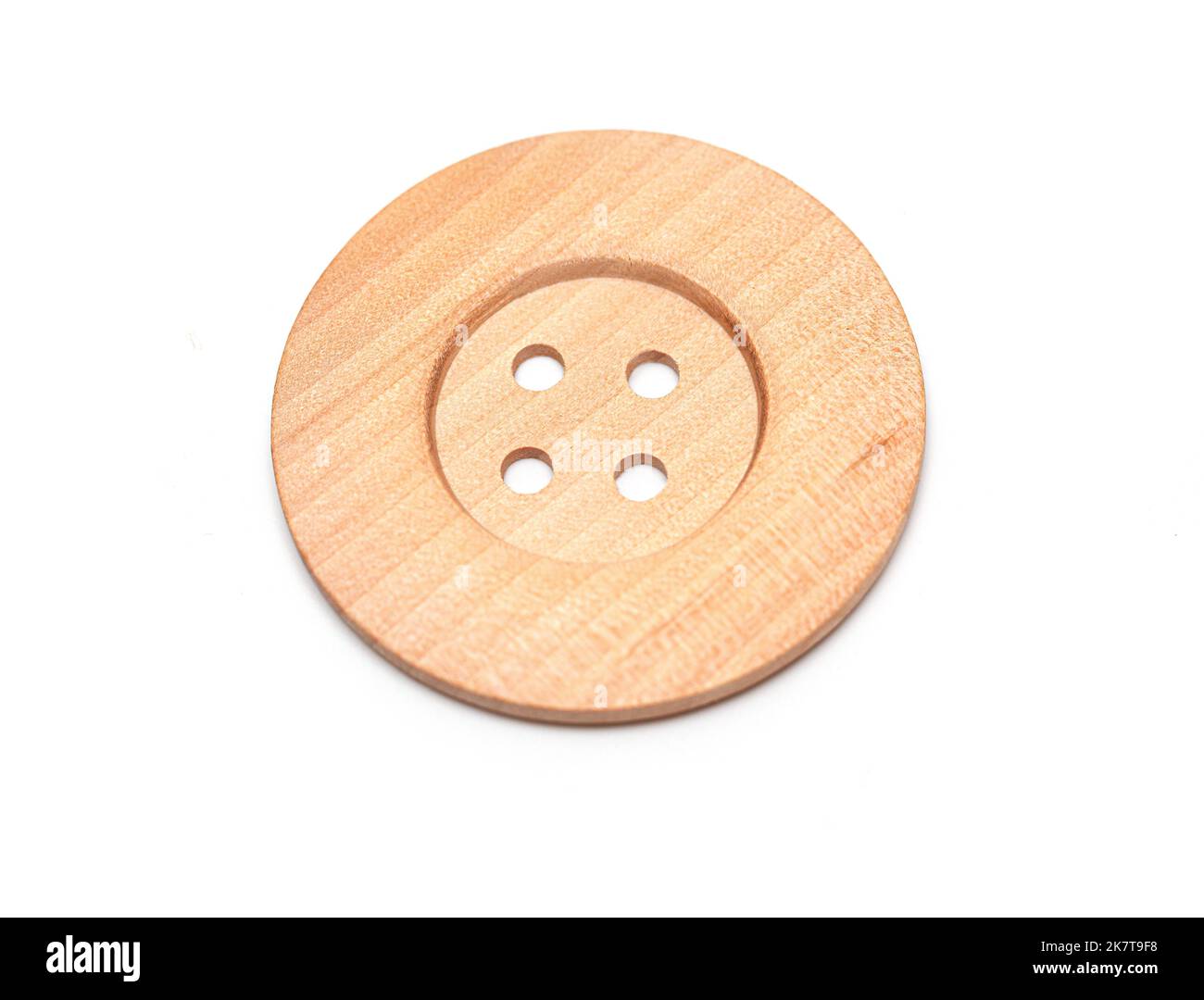 Wooden sewing button isolate on white background Stock Photo - Alamy