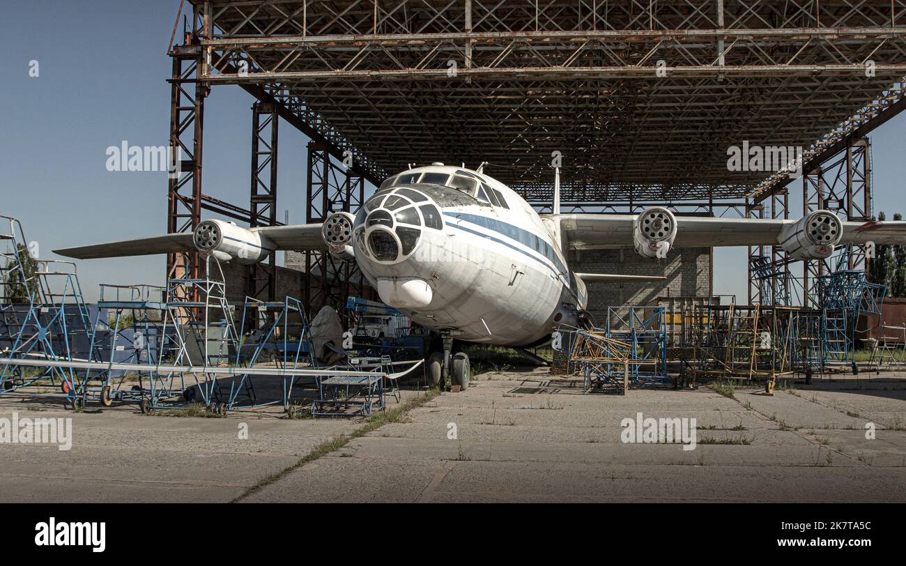 an old plane on the ground, in an old hangar Stock Photo - Alamy