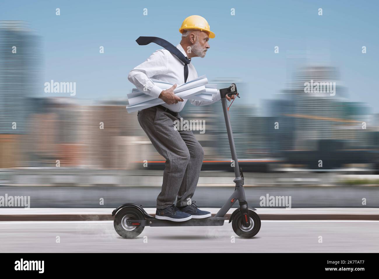 Professional engineer and architect wearing a safety helmet and riding ...