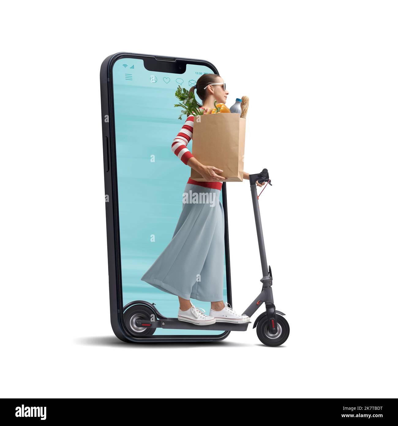 Woman holding a paper bag with groceries and riding an electric scooter, she is coming out from