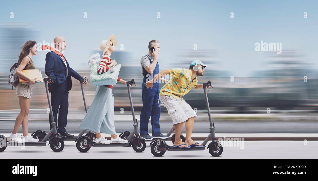 Crowd of diverse people riding electric scooters in the city street, smart mobility and traffic concept Stock Photo