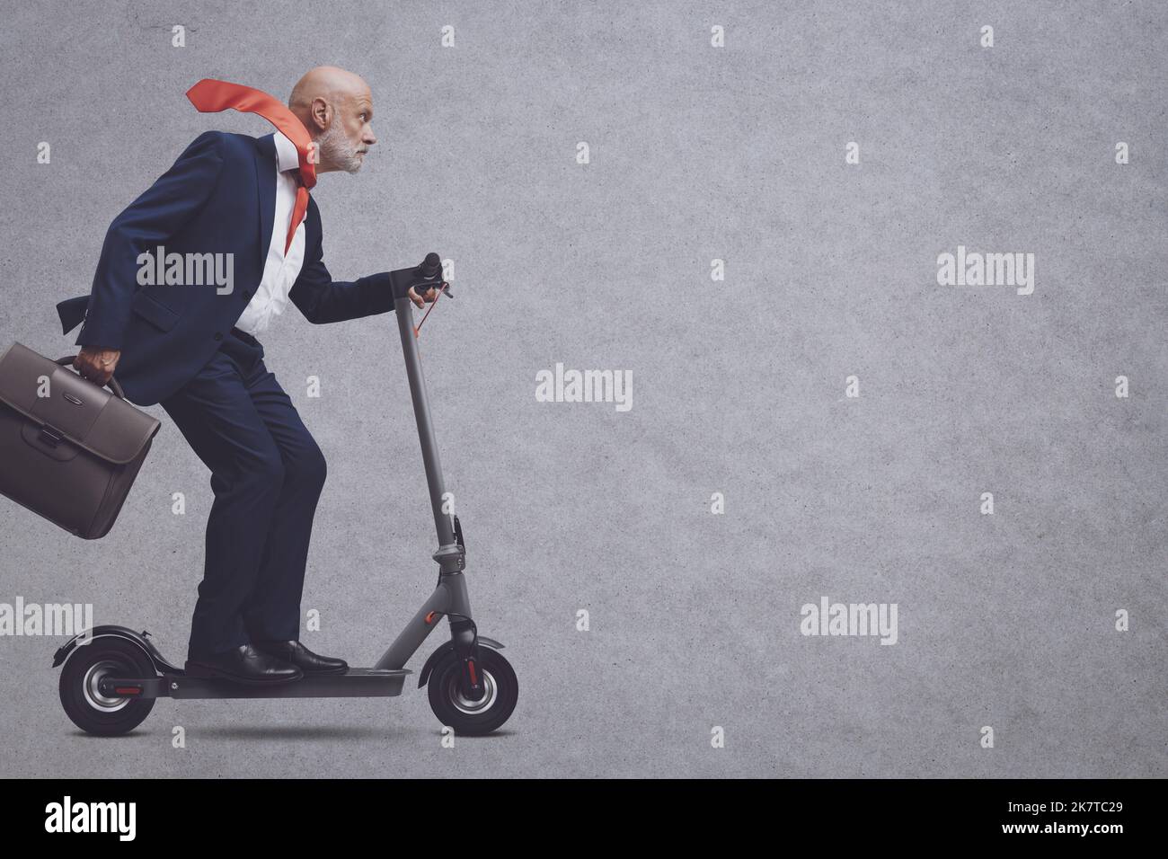 Corporate business executive riding a fast ecofriendly electric