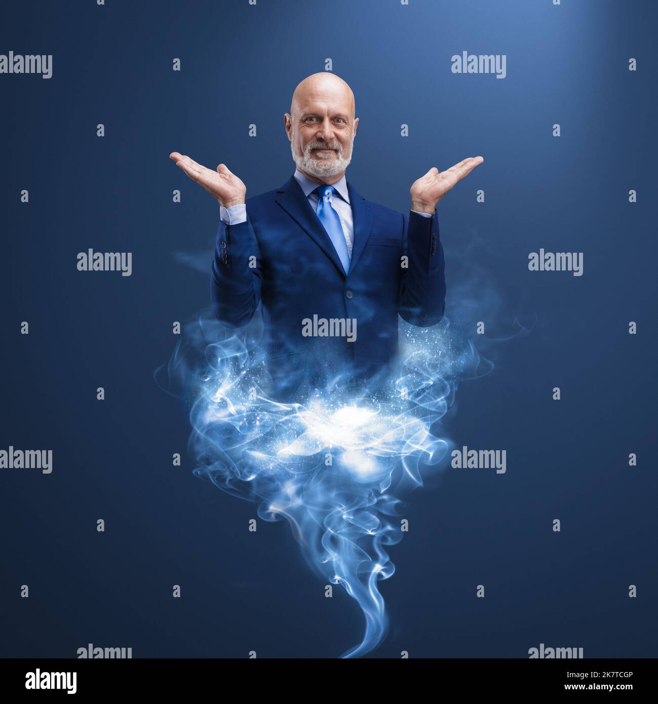 Businessman genie appearing and smoke, he is smiling and fulfilling wishes Stock Photo