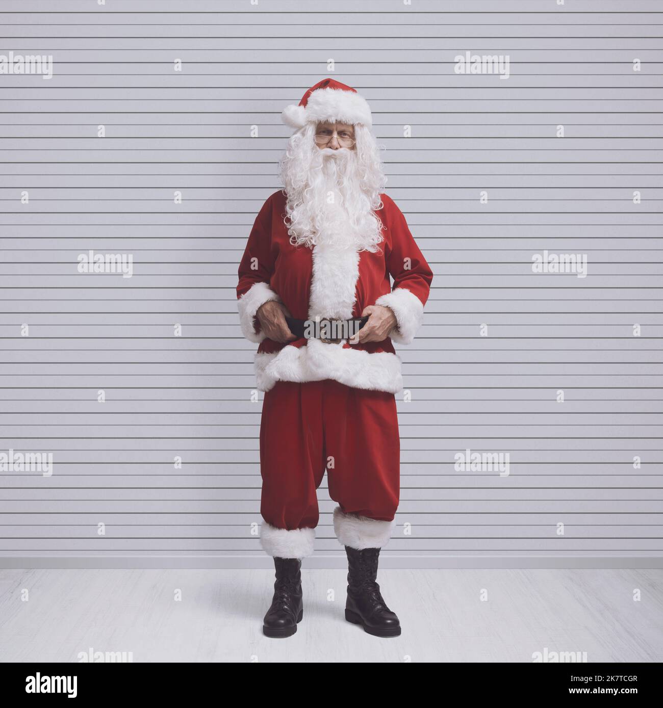 Disappointed Santa Claus posing for a mugshot at the police department Stock Photo