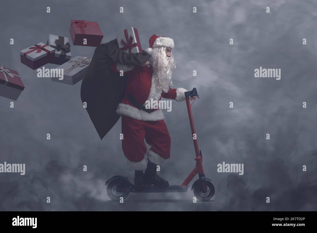 Santa Claus riding a scooter and delivering Christmas gifts, he is surrounded by pollution, smog and toxic gases Stock Photo